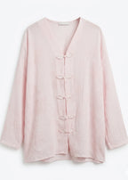 Blouse rose fermetures brandebourgs col V
